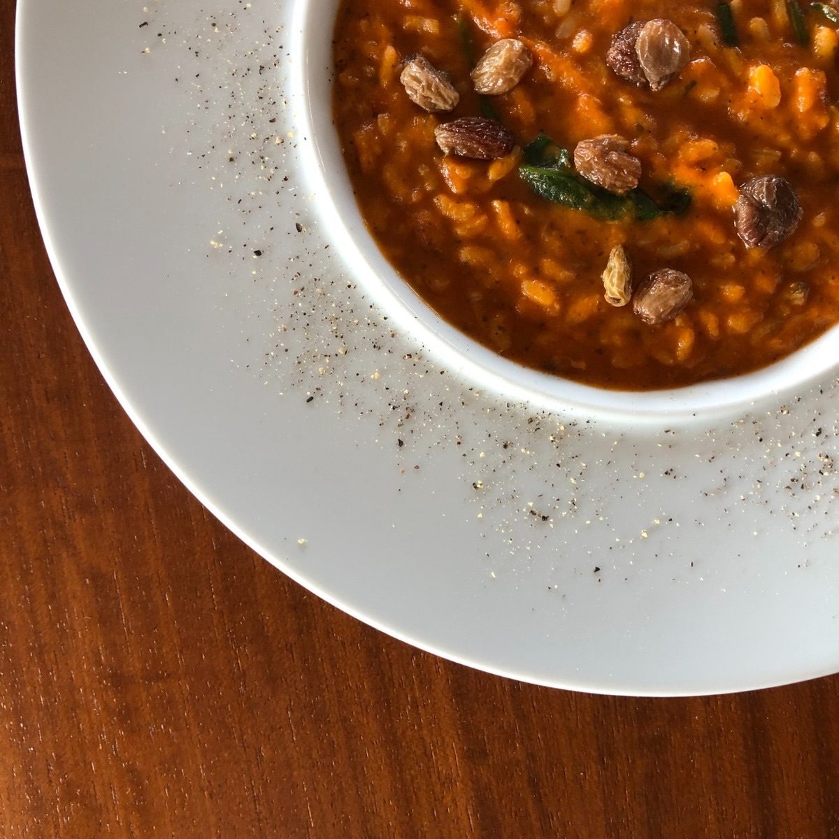 Pumpkin risotto with spinach and sultanas